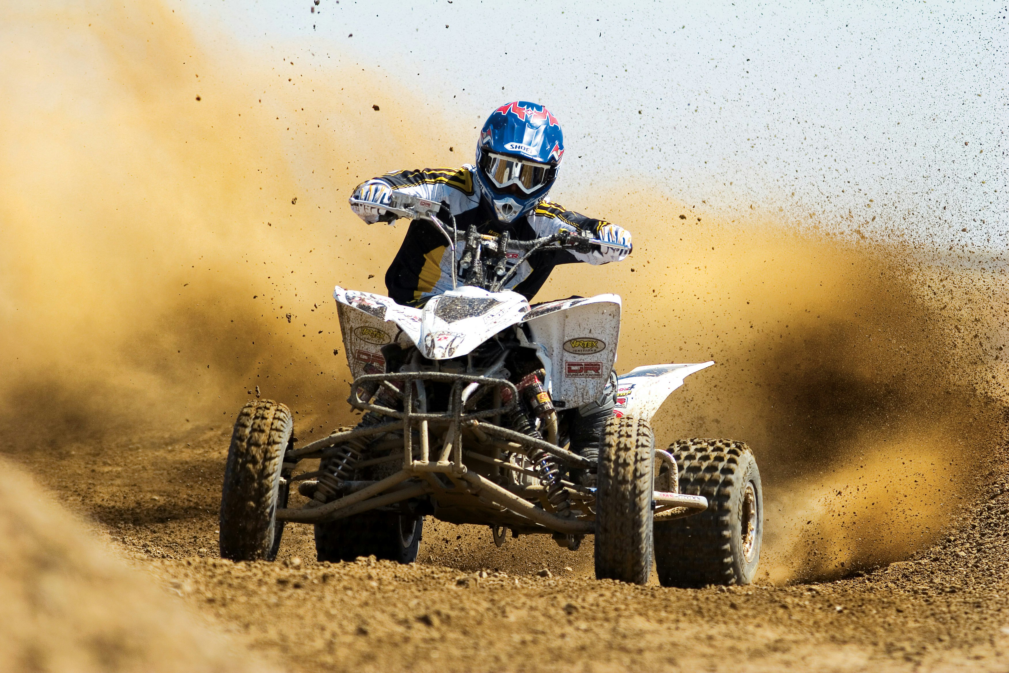 man riding ATV on the dessert